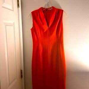 This be beautiful orange dress designed by Tahari size number two